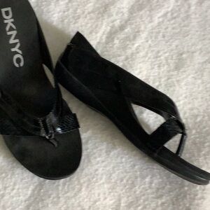 Dressy, comfortable sandal.  Straps are a shinny with two designs